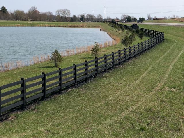 Board fencing around a pond